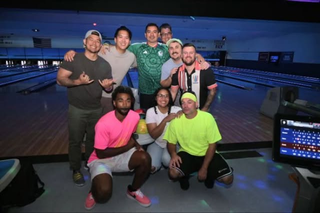 Rainbow Bowling Hawaii bowlers posing together on the lanes